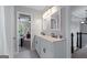 Bathroom with double sinks, decorative mirrors, and modern fixtures at 2864 Wyndcliff Ct, Marietta, GA 30066