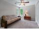 Neutral bedroom with a futon, dark wood accents, and natural light from two windows at 2864 Wyndcliff Ct, Marietta, GA 30066