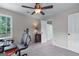 Bright bedroom with an open doorway, neutral carpet, and a ceiling fan at 2864 Wyndcliff Ct, Marietta, GA 30066