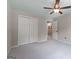 Spacious bedroom with fan lighting, closet, and open doorway to other rooms at 2864 Wyndcliff Ct, Marietta, GA 30066