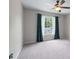 Bright bedroom with a ceiling fan and a window that overlooks the yard at 2864 Wyndcliff Ct, Marietta, GA 30066