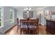 Elegant dining room with hardwood floors, a chandelier, and large windows at 2864 Wyndcliff Ct, Marietta, GA 30066