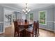Formal dining area with a large wooden table, seating for eight, and abundant natural light at 2864 Wyndcliff Ct, Marietta, GA 30066