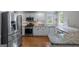 Bright kitchen with stainless steel appliances, granite countertops, and ample cabinet space at 2864 Wyndcliff Ct, Marietta, GA 30066