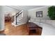 Comfortable living room with hardwood floors, a sofa, and access to dining area at 2864 Wyndcliff Ct, Marietta, GA 30066