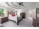 Spacious main bedroom with a tray ceiling, ceiling fan, and private bathroom entrance at 2864 Wyndcliff Ct, Marietta, GA 30066