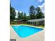 The property includes an in-ground pool, perfect for hot summer days and outdoor fun at 2913 Jordan Forest Trail, Lawrenceville, GA 30044
