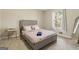 Comfortable bedroom with a queen-sized bed, plush carpet, and natural light from the window at 4064 Chimney Ridge Way, Ellenwood, GA 30294