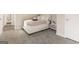 Bright bedroom featuring cozy bedding and carpet at 4064 Chimney Ridge Way, Ellenwood, GA 30294