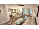 Open concept bar area with a granite countertop, barstool seating, and a cozy lounge nearby at 4564 Investors Ln, Ellenwood, GA 30294