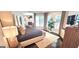 Inviting bedroom featuring large windows, plantation shutters and stylish modern decor at 4564 Investors Ln, Ellenwood, GA 30294