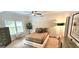 This bedroom boasts natural light, neutral tones and modern ceiling fan at 4564 Investors Ln, Ellenwood, GA 30294