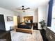 Comfortable bedroom with contemporary decor, dark wood floors, and a ceiling fan at 4564 Investors Ln, Ellenwood, GA 30294