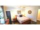 Cozy bedroom with modern decor, side tables with lamps, wood-look flooring, and plenty of natural light at 4564 Investors Ln, Ellenwood, GA 30294
