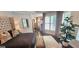 Bright bedroom boasting natural light, a fireplace, and comfortable furnishings at 4564 Investors Ln, Ellenwood, GA 30294