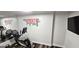 Home gym with motivational artwork and modern exercise equipment at 4564 Investors Ln, Ellenwood, GA 30294