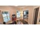Inviting hallway with a popcorn machine and view into bedroom, brightened by natural light at 4564 Investors Ln, Ellenwood, GA 30294