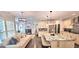 Gourmet kitchen open to the living room with granite countertops and a central island at 4564 Investors Ln, Ellenwood, GA 30294