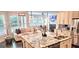 Bright, open concept kitchen and living room area with fireplace provides a modern living space at 4564 Investors Ln, Ellenwood, GA 30294