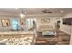 Open concept living area with bar counter, leading to a bright living area at 4564 Investors Ln, Ellenwood, GA 30294