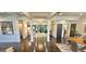 Open-concept living space with dark hardwood floors and abundant natural light at 4564 Investors Ln, Ellenwood, GA 30294