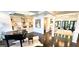 Bright open floor plan featuring hardwood floors and a piano with other rooms visible at 4564 Investors Ln, Ellenwood, GA 30294