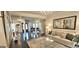 Cozy living room featuring a plush sofa, elegant decor, and an open layout at 4564 Investors Ln, Ellenwood, GA 30294
