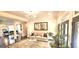 Spacious living room featuring hardwood floors, elegant furnishings, and natural light at 4564 Investors Ln, Ellenwood, GA 30294