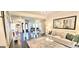 Well-lit living room with hardwood floors, stylish furnishings, and access to other rooms at 4564 Investors Ln, Ellenwood, GA 30294