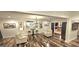 Stylish living area featuring hardwood floors, modern lighting, and comfortable seating at 4564 Investors Ln, Ellenwood, GA 30294
