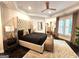 Main bedroom features dark wood floors, ample natural light and a comfortable seating area at 4564 Investors Ln, Ellenwood, GA 30294