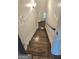 Elegant staircase showcasing rich, dark wood steps leading to a lower level, adding architectural charm at 4564 Investors Ln, Ellenwood, GA 30294