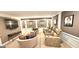 Comfortable theater room with reclining seats, a TV, and elegant decor at 4564 Investors Ln, Ellenwood, GA 30294