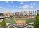 Aerial view of a grand amphitheater with a stage, seating, and lush greenery, perfect for outdoor events and community gatherings at 4972 Park Vale Dr, Sugar Hill, GA 30518