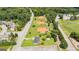 Aerial view showing ball fields near homes, with roads and tree-lined sidewalks, offering outdoor recreation and convenient access at 4972 Park Vale Dr, Sugar Hill, GA 30518