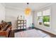Bright bedroom with hardwood floors, a large window and an area rug at 4972 Park Vale Dr, Sugar Hill, GA 30518