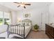Inviting bedroom with a decorative plant and large window views at 4972 Park Vale Dr, Sugar Hill, GA 30518