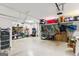 Spacious garage with ample storage solutions, including shelving and hanging racks at 4972 Park Vale Dr, Sugar Hill, GA 30518