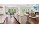Open-concept kitchen features stainless appliances, a large island and a breakfast area at 4972 Park Vale Dr, Sugar Hill, GA 30518