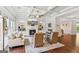 Bright living room features a coffered ceiling, fireplace, and built-in shelving at 4972 Park Vale Dr, Sugar Hill, GA 30518