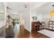 Open-concept area with hardwood floors adjoining a bedroom and living room at 4972 Park Vale Dr, Sugar Hill, GA 30518