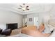 Cozy main bedroom suite with a tray ceiling and plenty of natural light at 4972 Park Vale Dr, Sugar Hill, GA 30518