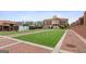 Open town square with a large green lawn, brick walkways, and the City of Sugar Hill building in the background at 4972 Park Vale Dr, Sugar Hill, GA 30518