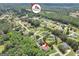 A neighborhood aerial shot featuring the home, surrounding houses, and local trees with a Main Street logo at 186 Ashley Dr, Mcdonough, GA 30252