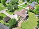 Overhead view of the home with a large backyard, stone landscaping, and mature trees at 186 Ashley Dr, Mcdonough, GA 30252