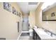 This bathroom offers a large vanity, a shower, a commode, and tasteful decorative touches at 186 Ashley Dr, Mcdonough, GA 30252