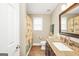 A bathroom featuring a shower, toilet, granite countertop, and tile flooring at 186 Ashley Dr, Mcdonough, GA 30252