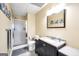 This bathroom offers a large vanity, a shower, a commode, and tasteful decorative touches at 186 Ashley Dr, Mcdonough, GA 30252