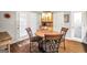 Cozy dining area with table and chairs, built-in cabinet, and natural light at 186 Ashley Dr, Mcdonough, GA 30252