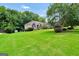 Well-maintained brick home set on a large lot with mature trees and landscaping at 186 Ashley Dr, Mcdonough, GA 30252